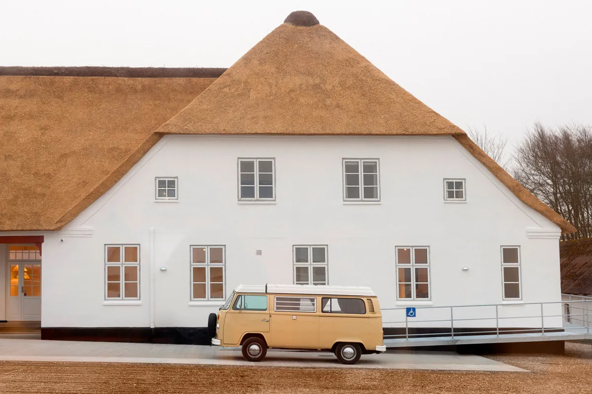 Thatched Roof House with Van